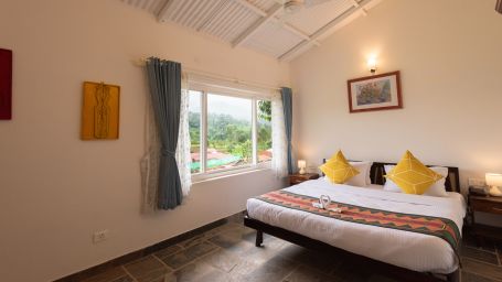 Annexe House Master Bedroom with a king bed and side tables - Ibex Stays & Trails, Kotagiri