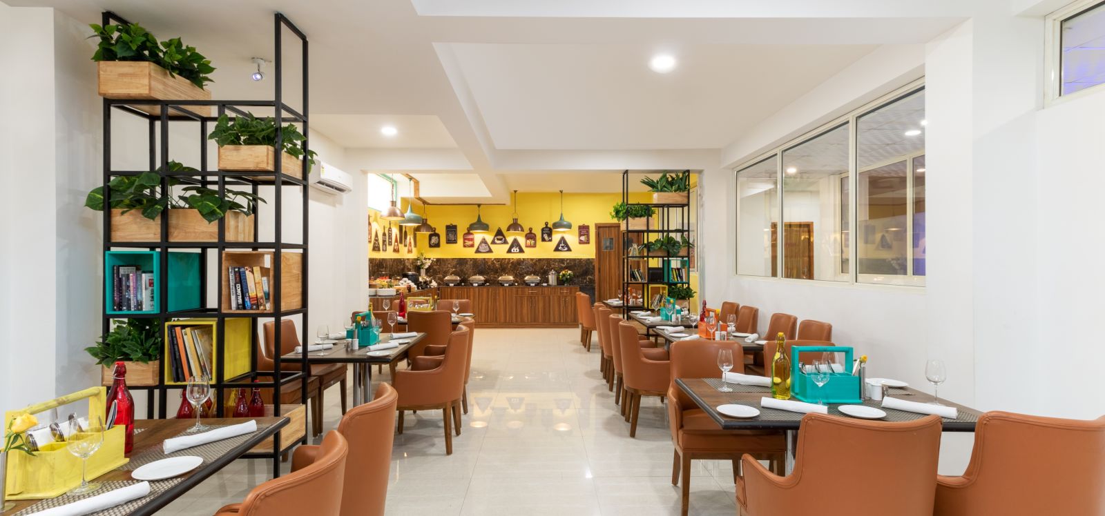 Cafe Inde seating area with chic ambience and brown chairs | Inde Hotel Cyber City