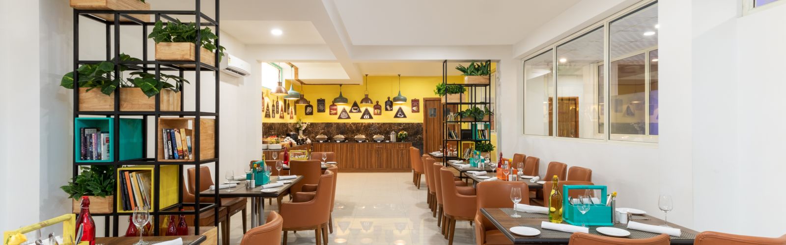 Cafe Inde seating area with chic ambience and brown chairs | Inde Hotel Cyber City