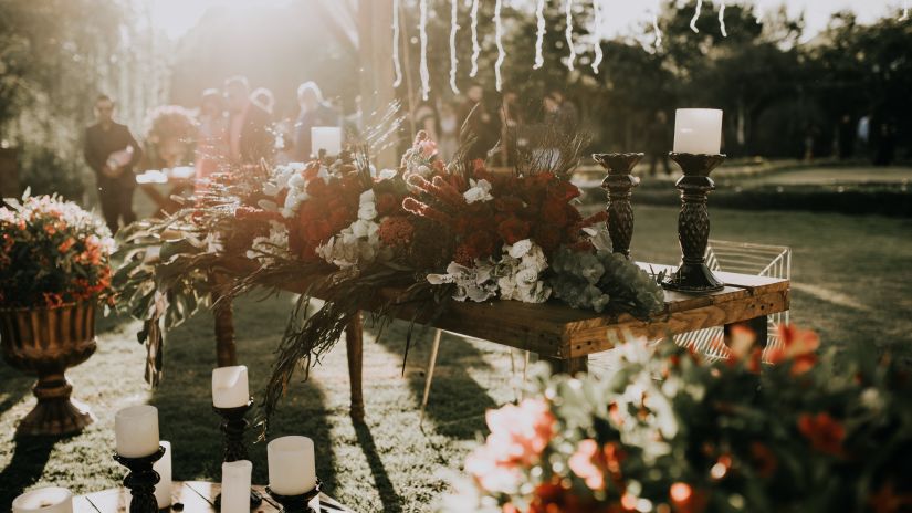 a garden decorated with flowers and other things for a wedding