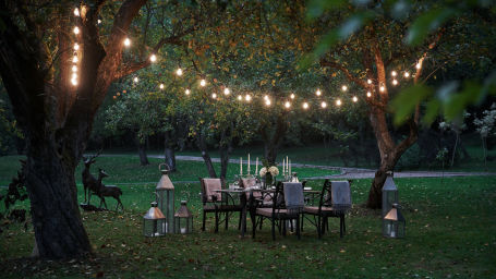 photo of a lawn area prepared desk waiting for food and visitors. evening time @ Lamrin Norwood Green, Palampur