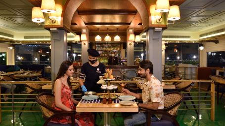 a couple ordering food at the dining space 3 - polo floatel kolkata