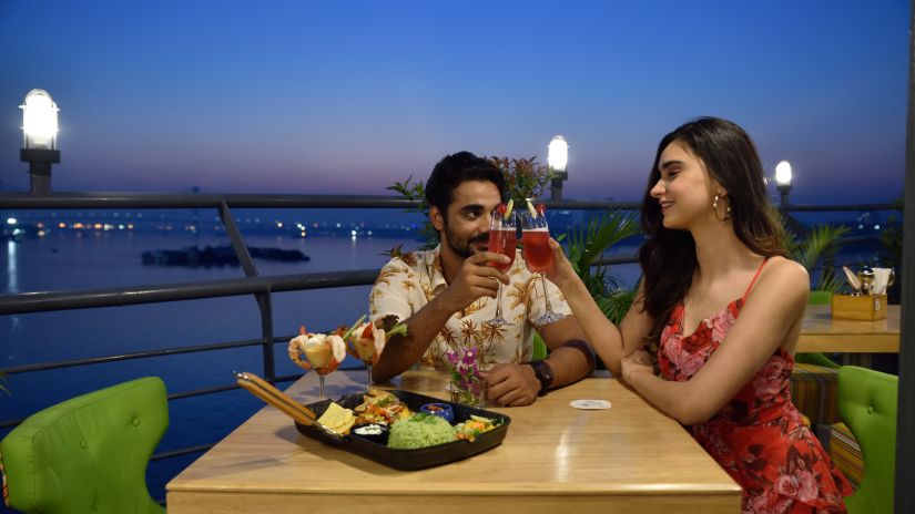 a couple having a dinner date at the outdoor seating area of the restaurant