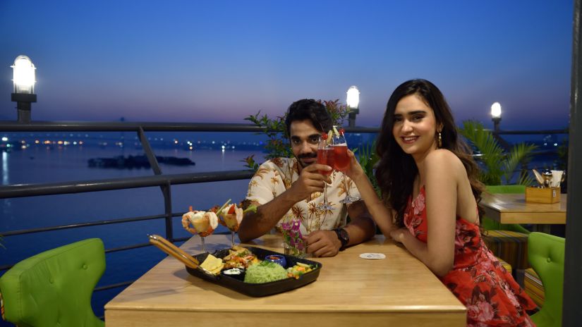 a couple having a dinner date at the outdoor seating area of the restaurant 2 - polo floatel kolkata