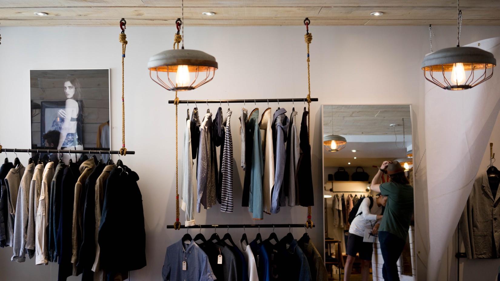 Blazers and vests on display at a clothing store