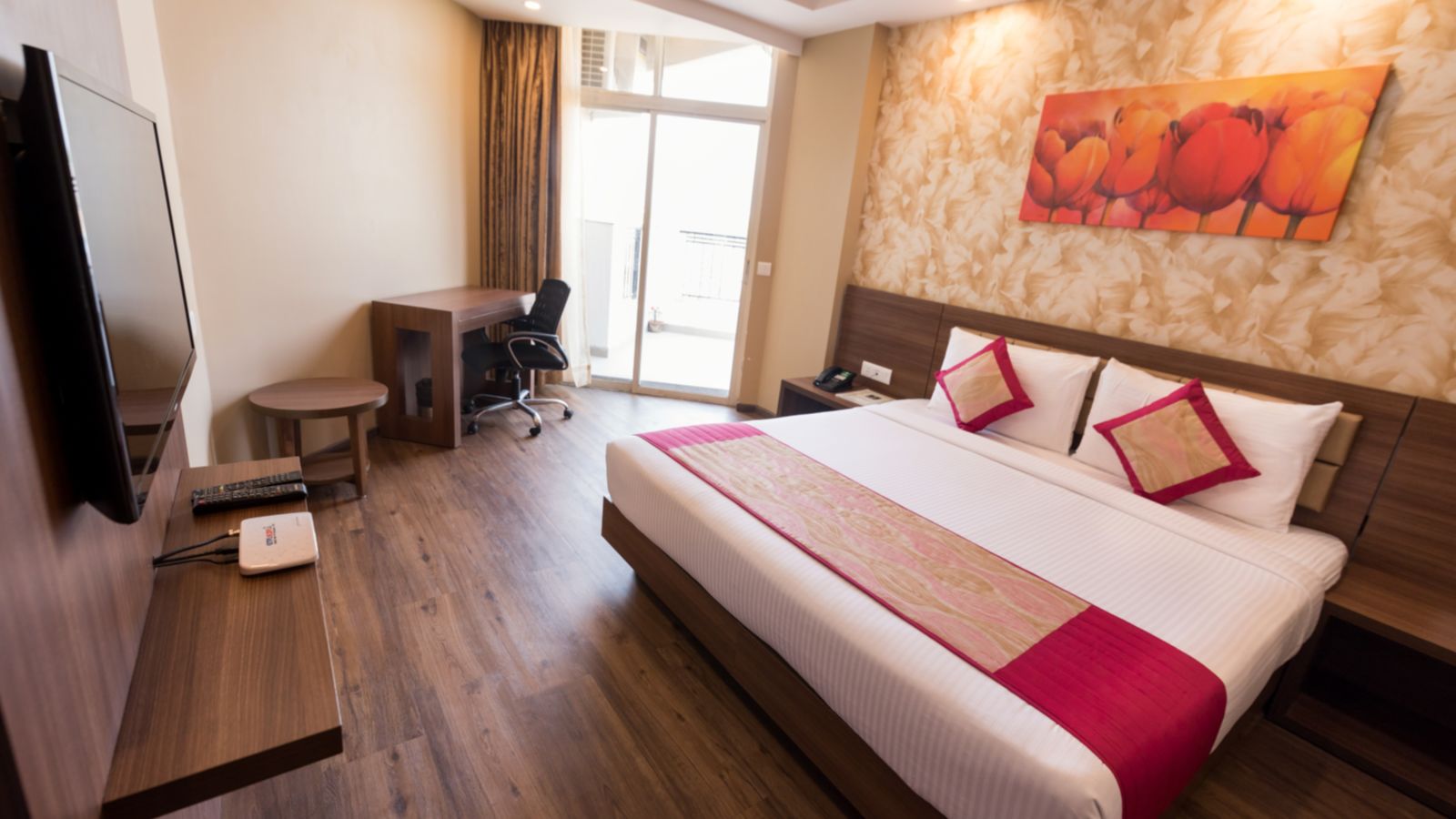 Suites Room with Complimentary Wi-Fi in a hotel room with separate living room that features a couch and a separate bedroom with a queen size bed - Le ROI Digha Hotel West Bengal9