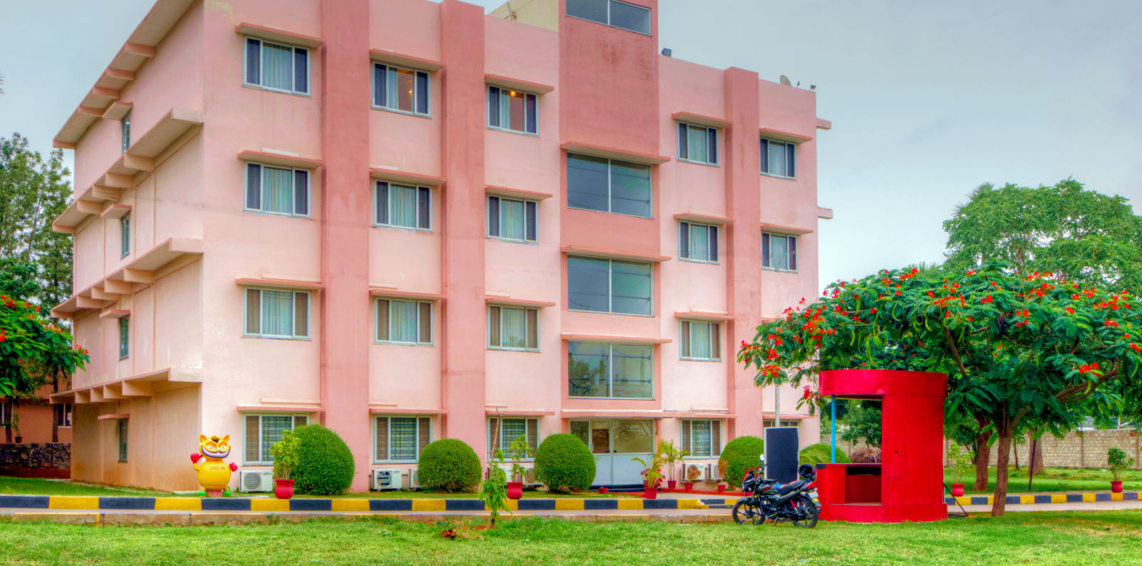 exterior of Greens Inn with a lawn infront of it