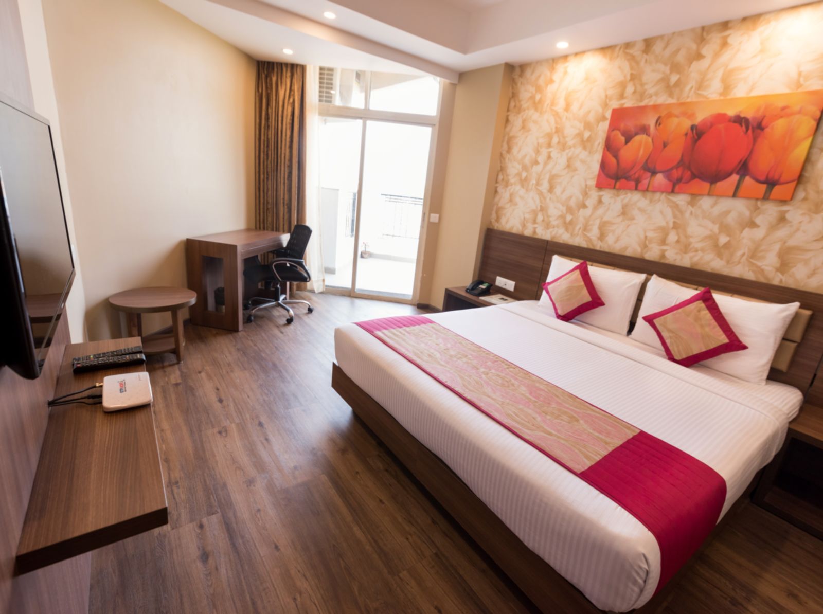 Suites Room with Complimentary Wi-Fi in a hotel room with separate living room that features a couch and a separate bedroom with a queen size bed - Le ROI Digha Hotel West Bengal9