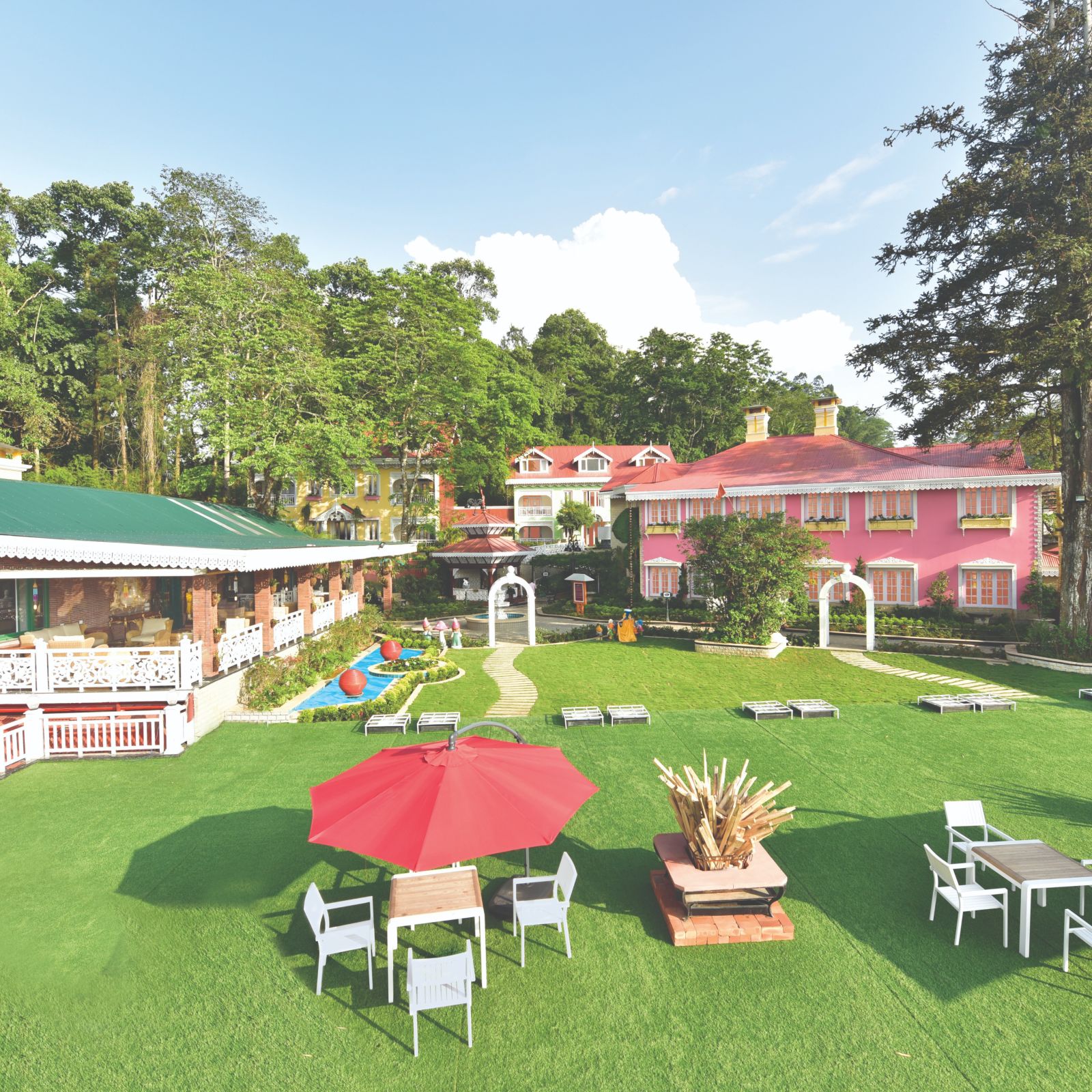 a panoramic view of the outside seating space at the lawn - Mayfair Himalayan Spa Resort Kalimpong