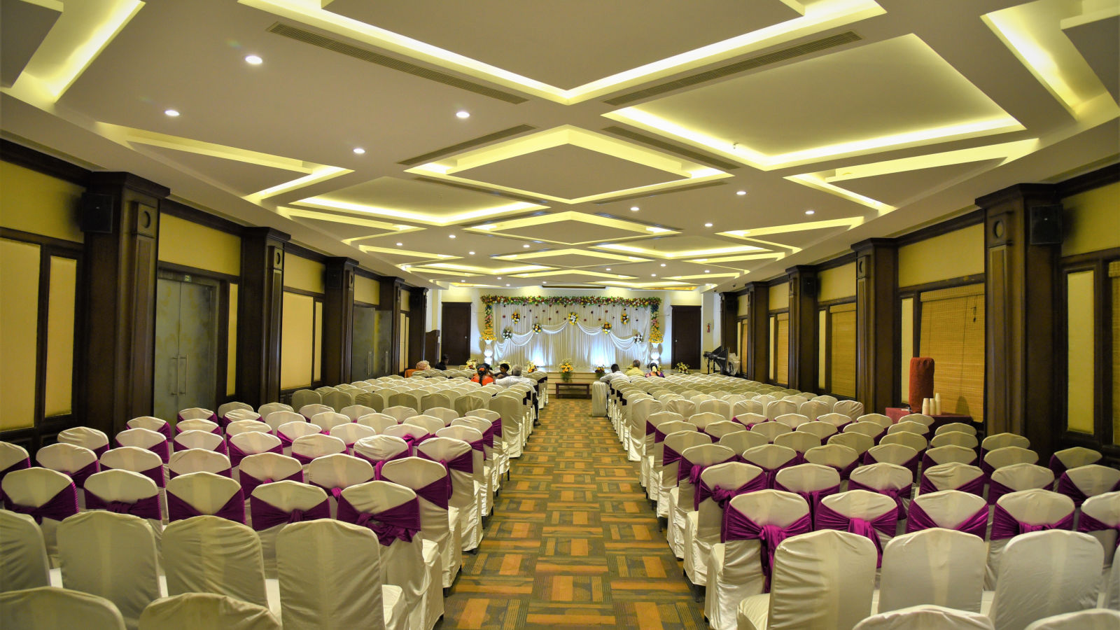 A meeting hall with a classroom seating arrangement