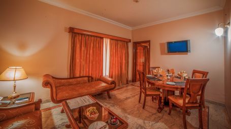 overview of the living area inside a suite room at Raj Park Hotel in Chennai