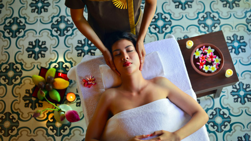 Woman receiving a face massage at a Spa