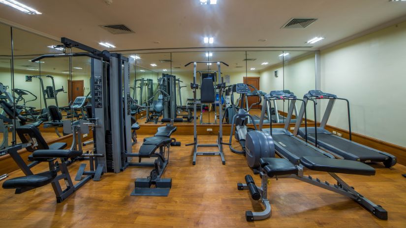 many gym equipment inside the fitness centre - Raj Park Hotel, Chennai