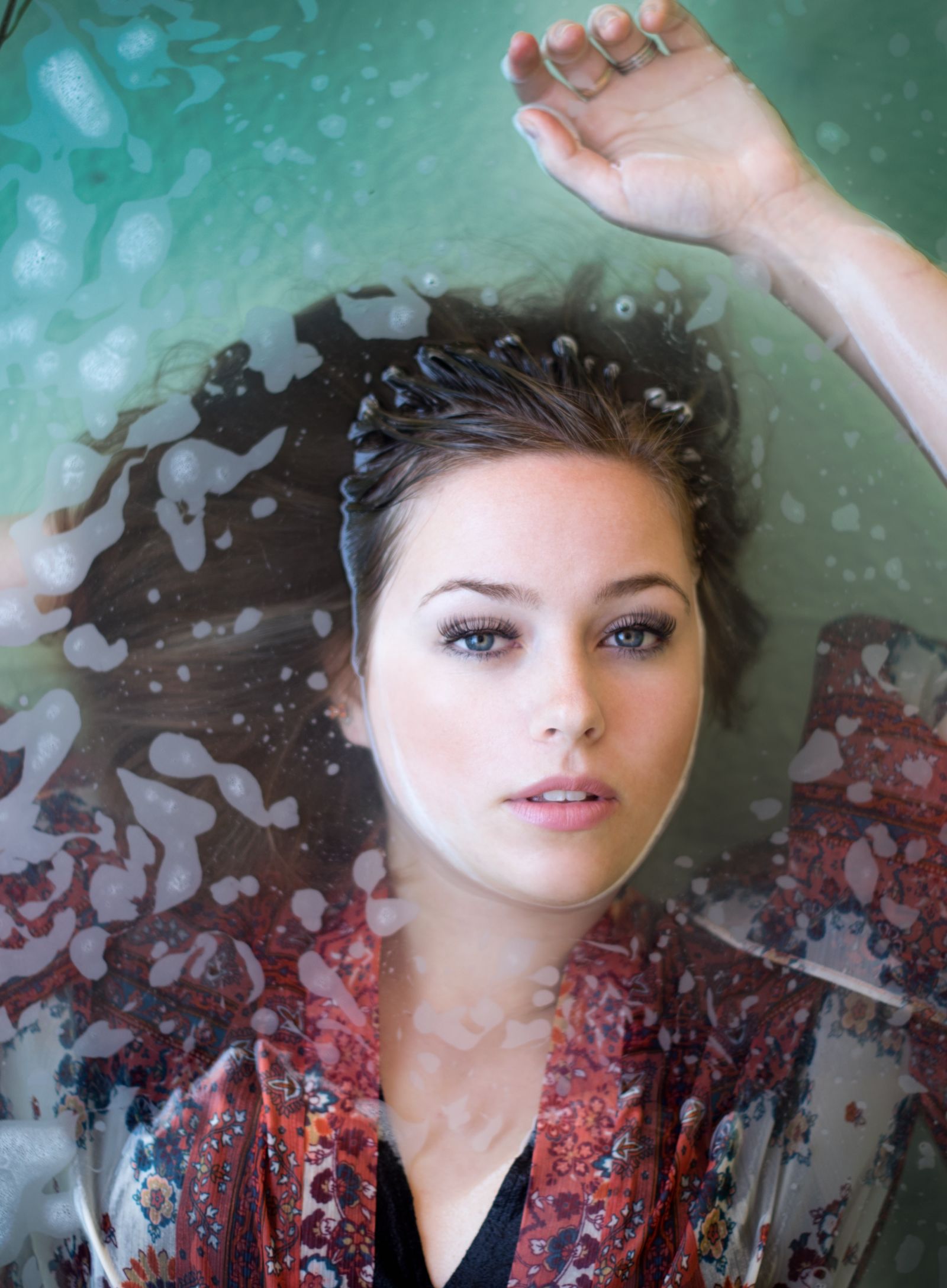 A woman partially submerged in water - Gamyam Retreat