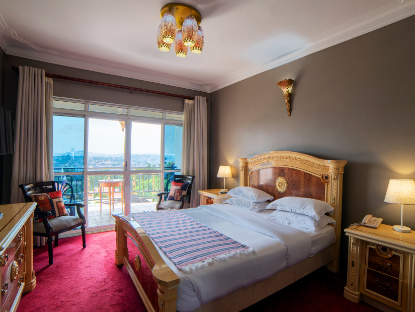 The Deluxe Rooms looks splendid in grey walls and red flooring