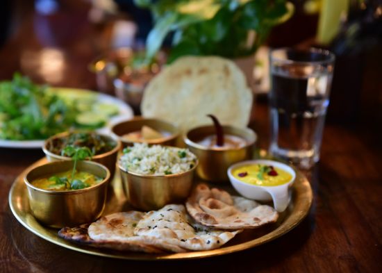 alt-text closeup-shot-indian-tasty-food-called-marwari-veg-thali-wooden-table