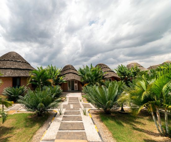 alt-text Masheda Palms Accommodations under a cloudy sky