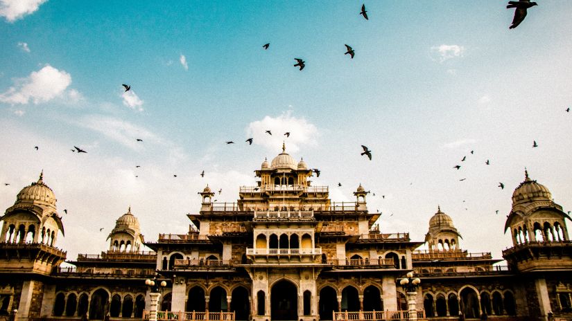 Pigeons flying over Albert Hall, a regal pre-wedding photoshoot location in Jaipur