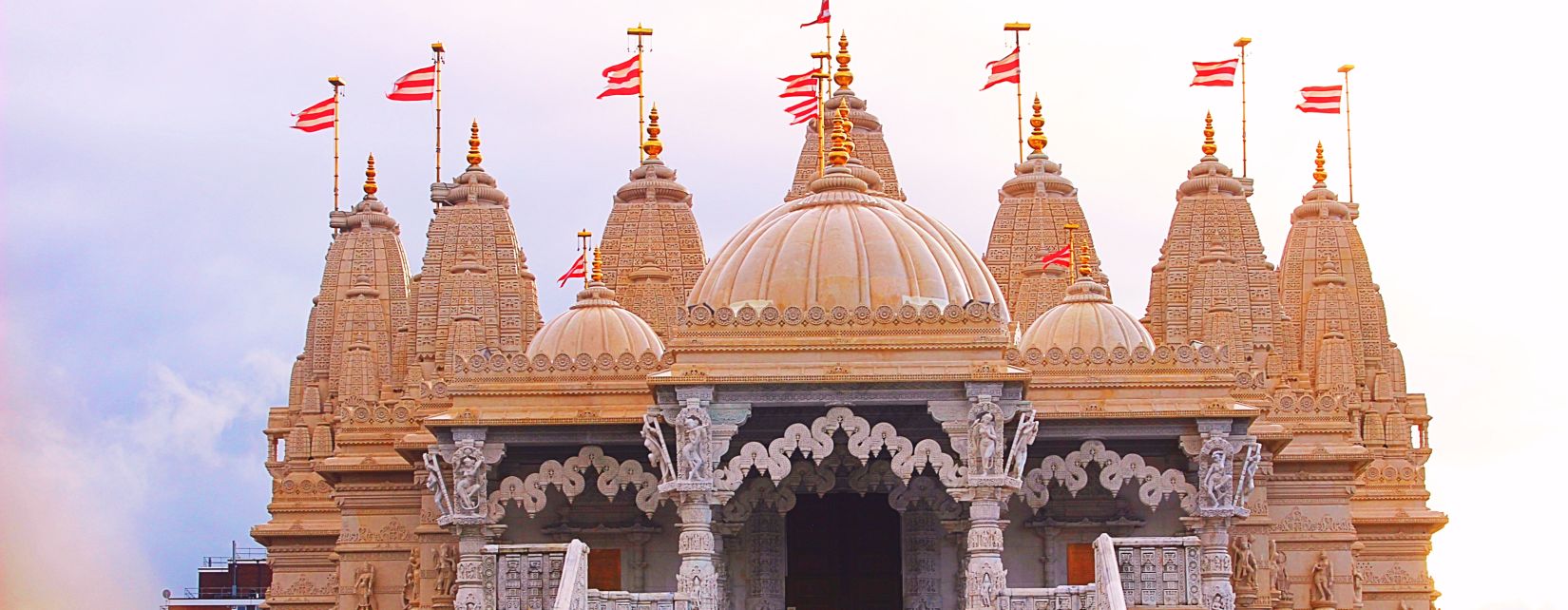 exterior view of a temple with a staircase in front