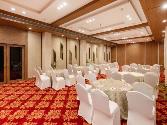 Round table seating arrangements inside the Banquet hall - The Orchid Hotel, Jamnagar