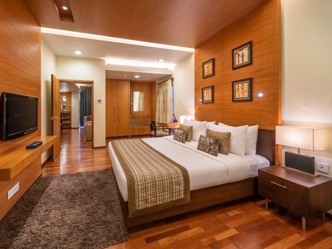 end-to-end view of the bedroom with a king size bed in the Russel Suite at Kenilworth Hotel, Kolkata