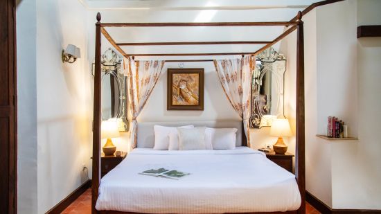 white pristine room @ Lamrin Ucassaim Hotel, Goa
