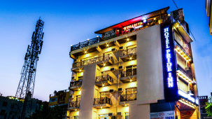 Facade of Vinsober Pride Inn, Rishikesh during blue hour