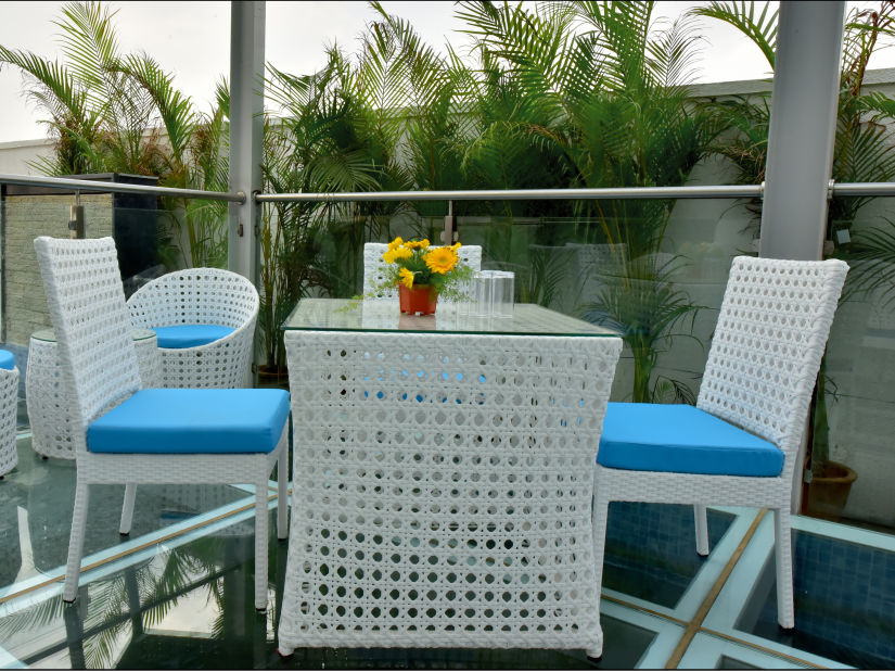 blue and white themed restaurant dining area of Lily restaurant offering outdoor dining experience - Royal Lotus View Resotel1