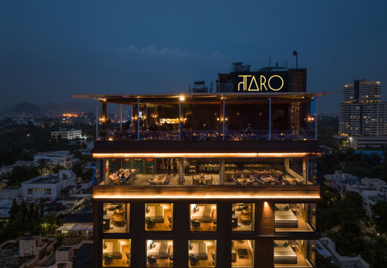 alt-text Facade of Parallel Hotel in Udaipur during night well lit 