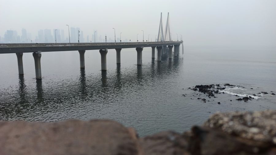 An overview of the Worli Sea Link Bridge with mist covering the end