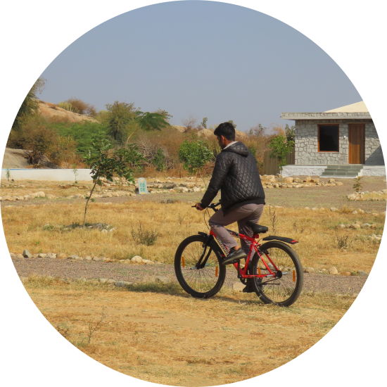 A person cycling on a field at Clark s Safari Jawai