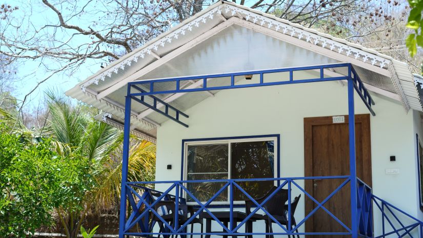 image of the facade of a cottage in Yelagiri with steps leading up to the cottage door - MGM Whispering Wind's, Yelagiri