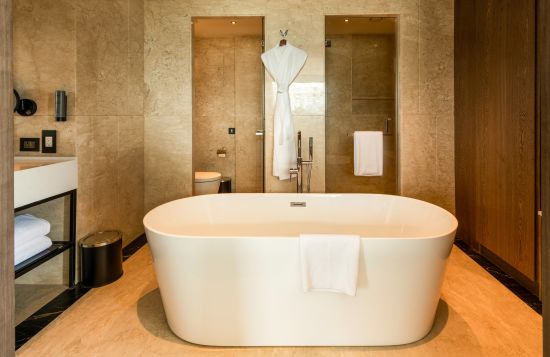alt-text A bathtub inside Hollywood Suite washroom - parallel hotel, udaipur