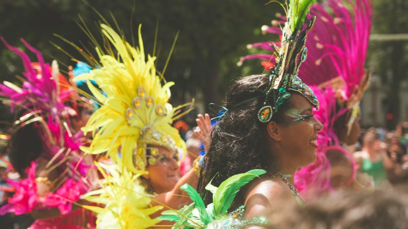 women on the street captured with colourful costumes and dressed in bright clothing and enjoying at a carnival