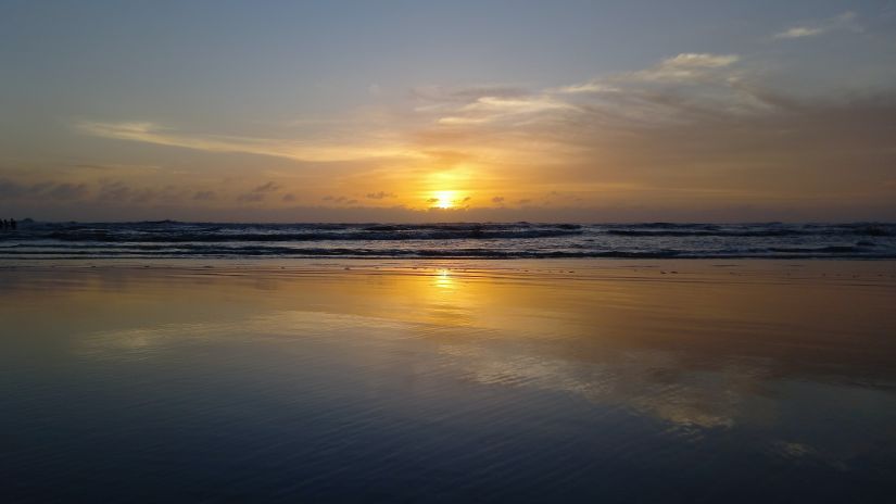 an image of the sun and its reflection displayed on water