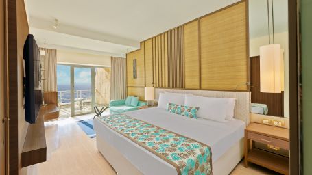 A side view of a bedroom with a bed | The Resort