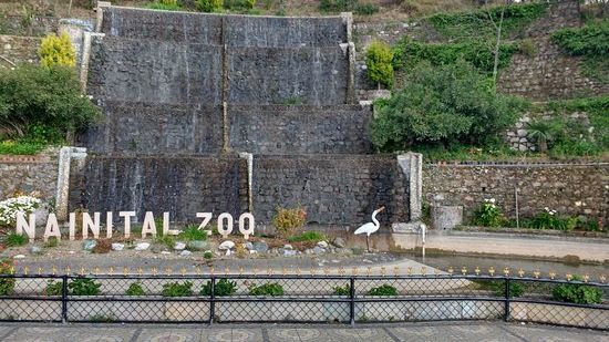 An exterior view of the nainital-zoo with a name board.