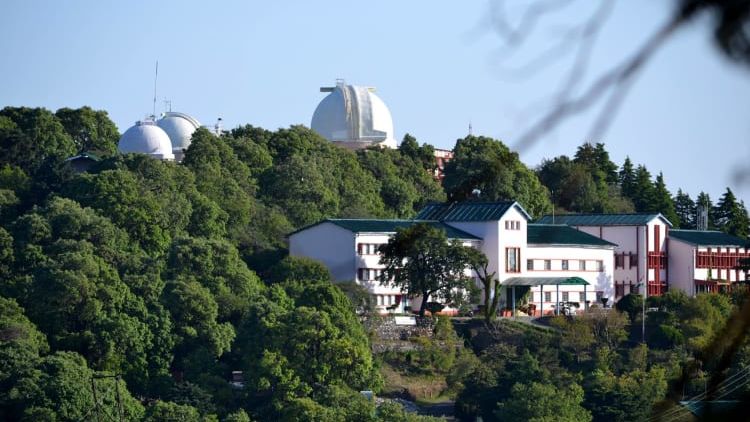 An exter view of the observatory surrounded by the trees.