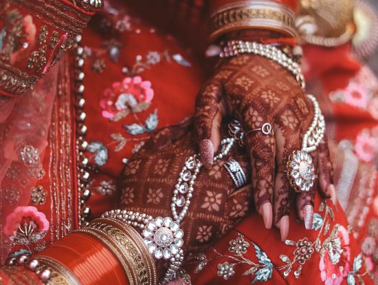 bride with henna covered hands