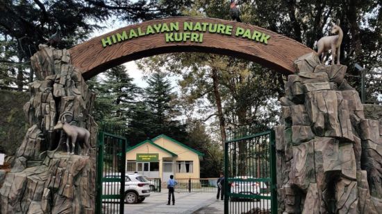 The entrance of Himalayan Nature Park in Kufri, marked by a grand archway with sculptures of wildlife, welcoming visitors into the sanctuary.