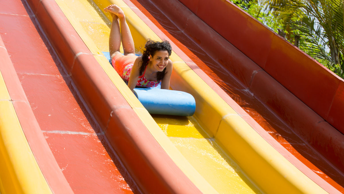 Lady going down a water slide