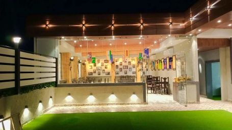 a lavishly decorated interior of kapil eleven resto - Click Hotel Capital House, Patna