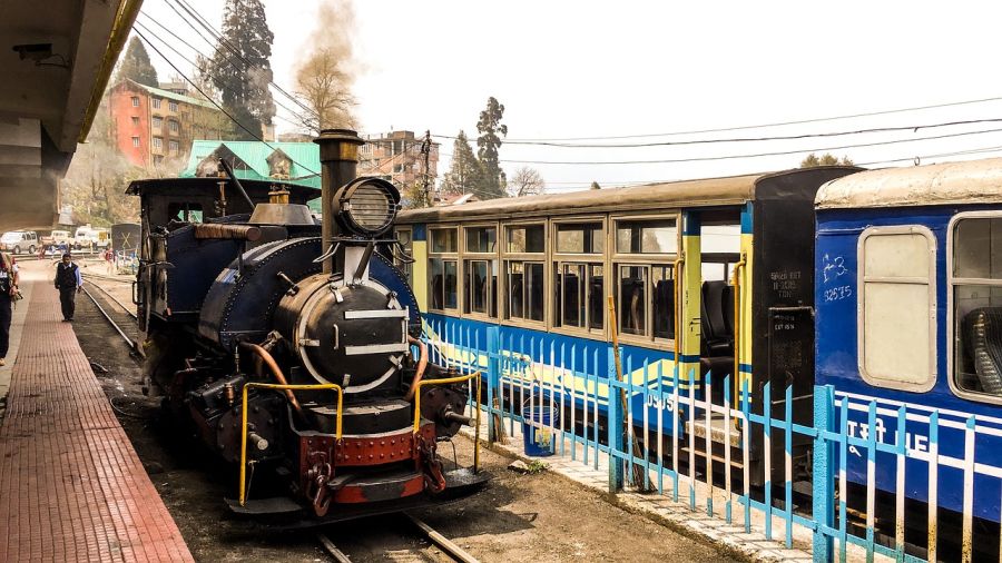 a toy train pulling up to a station