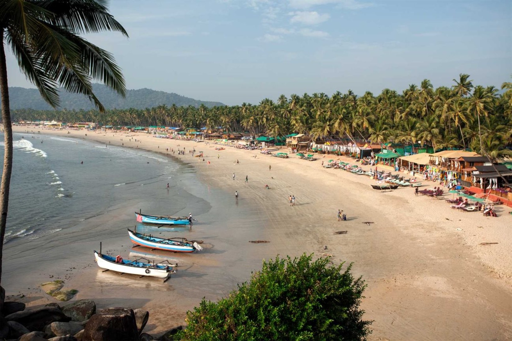 Goa beach with a few boats docked in the sand - Villa in Palms by V Escapes