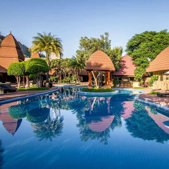 A panorama with the shades and lunge chairs around our day pool 