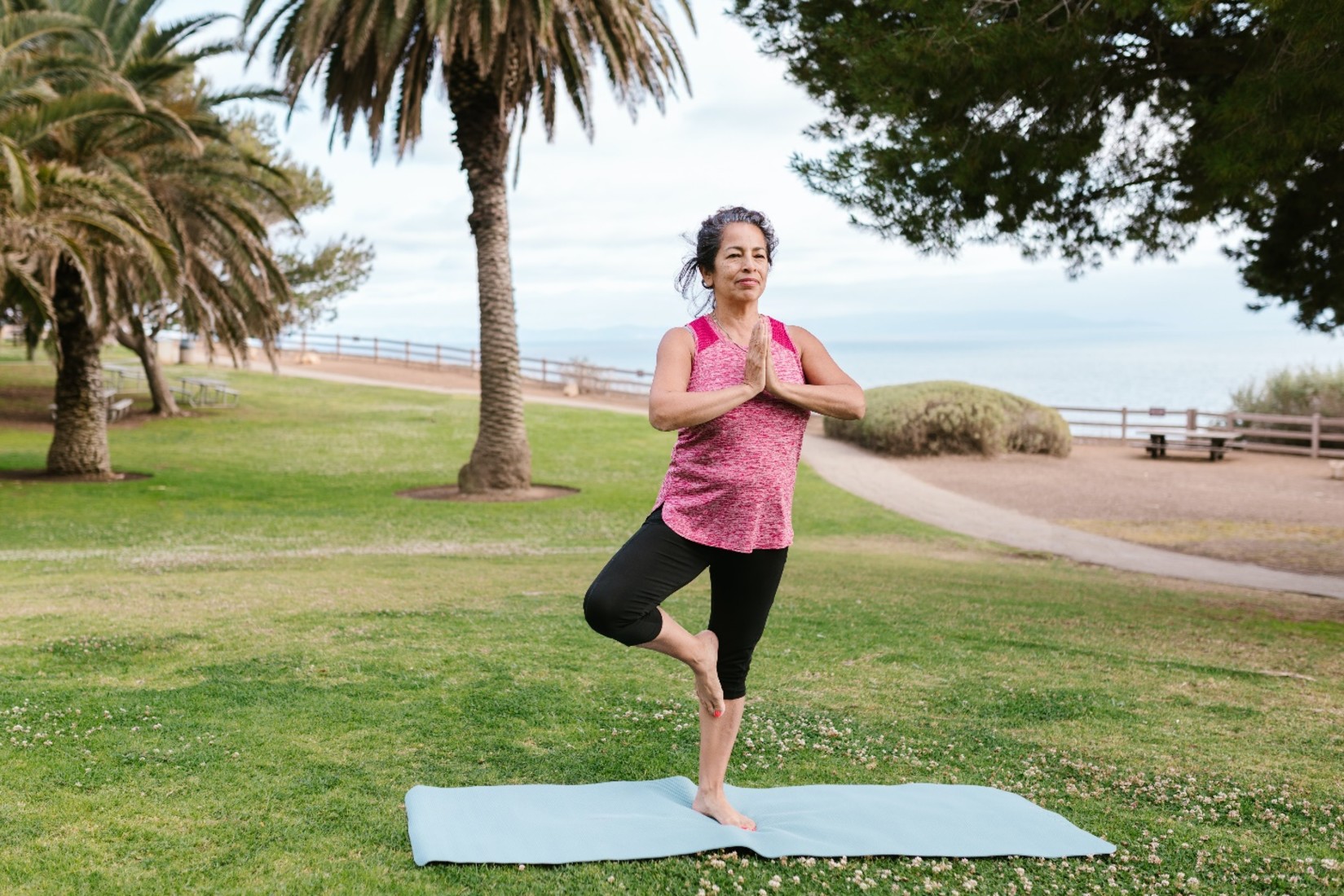 YO1 Resorts Catskills - A woman stood up in a yoga aasan