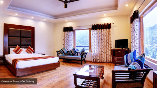 Premium Room with bed, seating area with coffee table at Summit Chandertal Regency Hotel & Spa