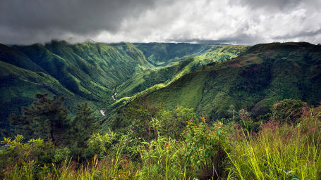 an aerial view of green valleys