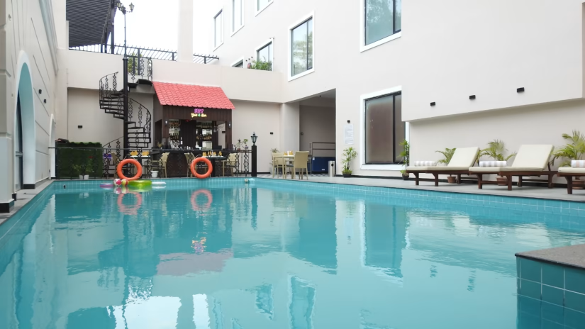 Overview of the swimming pool at Splash Pool deck with loungers on the side - Hotel Polo Towers, Agartala