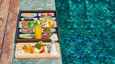 assorted food platter at poolside